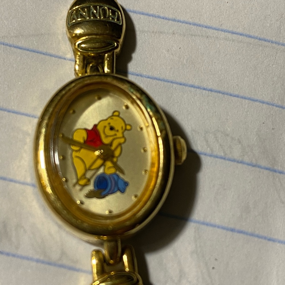 Women’s gold Winnie the Pooh watch